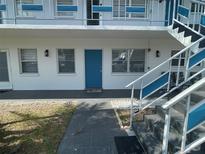 Charming condo with a welcoming entrance and modern exterior staircase at 1921 58Th N Ave # 11, St Petersburg, FL 33714