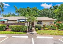 Charming single-story home with a well-maintained lawn and a nicely landscaped front yard at 2919 Fig Ct, Palm Harbor, FL 34684