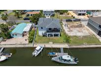 Beautiful aerial view of waterfront home with private dock and boat access, a perfect home for boaters at 4464 Neptune Dr, Hernando Beach, FL 34607
