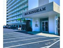 Buckingham building entrance featuring well-maintained landscaping and convenient parking at 6060 Shore S Blvd # 903, Gulfport, FL 33707