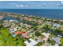 Stunning aerial view of waterfront homes, docks and access to the open ocean on a sunny day at 6468 Rubia Cir, Apollo Beach, FL 33572