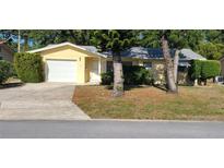 Charming single-story home with well-maintained lawn and landscaping at 9805 110Th Ln, Seminole, FL 33772