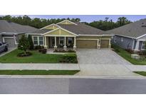 Charming single-Gathering home with a well-manicured lawn and two-car garage at 4239 Woodland Retreat Blvd, New Port Richey, FL 34655