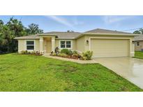 Charming single-story home with a well-manicured lawn and inviting front entrance at 5153 Bayley St, North Port, FL 34288