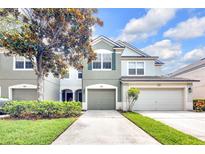 Charming two-story townhome with attached two-car garage and well-manicured landscaping at 4910 Chatham Gate Dr # Dr, Riverview, FL 33578