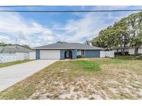 Charming single-story home with a well-maintained lawn and attached garage at 5540 Applegate Dr, Spring Hill, FL 34606