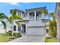 Contemporary two-story home featuring a clean, modern design and a spacious two-car garage at 6526 Simone Shores Cir, Apollo Beach, FL 33572