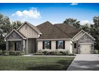 Charming single-story home with stone accents, a two-car garage, and a well-manicured lawn at 13607 Oldenburg Ave, Hudson, FL 34667