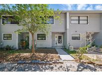 Charming two-story townhouse with a landscaped front yard and a welcoming entrance, beautiful exterior view at 3004 Conifer Dr, Largo, FL 33771