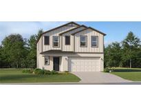 Charming two-story home with a two car garage, landscaped front yard and neutral paint at 5615 Red Kite Dr, Wimauma, FL 33598