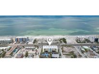 Expansive aerial view of the beach condo showcasing its stunning beachfront location at 14401 Gulf Blvd # 106, Madeira Beach, FL 33708