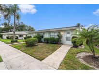 Charming single-story condo with well-manicured landscaping and a welcoming entrance at 301 Andover S Pl # 175, Sun City Center, FL 33573