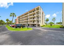 Spacious condo complex featuring private balconies, lush landscaping and convenient parking at 9450 Harbor Greens Way # 207, Seminole, FL 33776