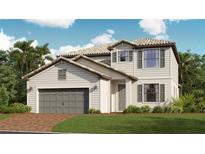 Charming two-story home featuring a two-car garage, well-manicured lawn, and beautifully designed architecture at 15074 Serene Shores Loop, Bradenton, FL 34211