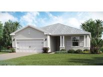 Charming single-story home featuring a two-car garage, well-manicured lawn, and inviting front entry at 15135 Oxford Grey Dr, Bradenton, FL 34211