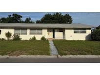 Charming single-story home with a quaint front porch and well-manicured lawn at 5600 9Th N Ave, St Petersburg, FL 33710