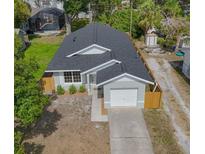 Charming single-story home with a well-maintained lawn, an attached garage, and a fenced yard at 7551 52Nd N St, Pinellas Park, FL 33781