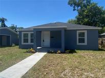 Charming blue home with a well-maintained lawn and inviting front porch at 1108 11Th S Ave, St Petersburg, FL 33705