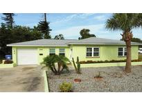 Charming single-story home with a well-maintained lawn and lovely landscaping and a one car garage at 2444 35Th N St, St Petersburg, FL 33713