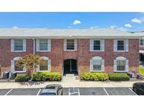 Charming brick condo building with well-maintained landscaping and convenient parking spaces at 3515 41St S Ter # 224, St Petersburg, FL 33711