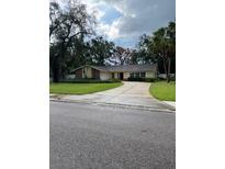Charming single-story home with a well-maintained front yard and long driveway at 5281 Venetian Ne Blvd, St Petersburg, FL 33703