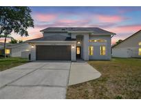 Beautiful two-story home featuring a two-car garage and well-maintained landscaping, perfect for suburban living at 12102 Steppingstone Blvd, Tampa, FL 33635