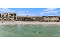 Beachfront condo building with stunning ocean views and white sand beach at 14900 Gulf Blvd # 308, Madeira Beach, FL 33708