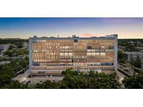 Stunning condominium building featuring multiple stories and large windows with cityscape views at 3211 W Swann Avenue # 707, Tampa, FL 33609