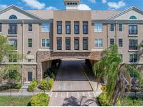 Stunning building exterior featuring stone accents, neutral paint, black metal balconies, and lush landscaping at 4221 W Spruce St # 2302, Tampa, FL 33607