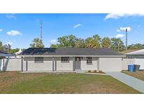 Charming single-story home with a well-maintained front yard and freshly painted exterior at 4803 Sierra Madre Dr, Tampa, FL 33634