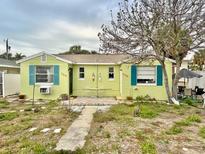 Charming one story home featuring a cozy front yard and well maintained exterior at 503, 509, Cottage, Land 69Th Ave, St Pete Beach, FL 33706