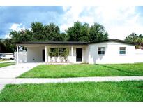 Charming single-story home featuring a well-manicured lawn and freshly painted exterior at 5625 Gateway Dr, Tampa, FL 33615
