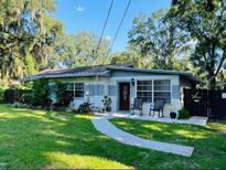 Charming single-story home with well-maintained landscaping and inviting front porch at 11107 Riverview Dr, Riverview, FL 33578