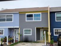 Charming townhomes featuring colorful exteriors, and inviting front entrances at 3041 S Pines Dr # 52, Largo, FL 33771