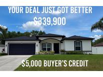 Charming single-Gathering home featuring a well-manicured lawn and a two-car garage at 4264 Michaler St, North Port, FL 34286