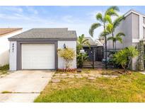 Charming single-Gathering home with a well-manicured lawn and a one car garage at 4521 Tidal Pond Rd, New Port Richey, FL 34652