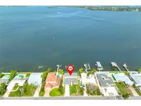 Waterfront property featuring a private dock with deep water access to the open bay, offering boating and fishing at 4823 Arlington Rd, Palmetto, FL 34221
