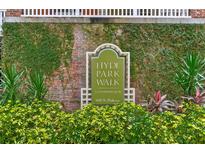 Hyde Park Walk condominium sign amidst lush greenery, showcasing the property's welcoming entrance and established community at 800 S Dakota Ave # 429, Tampa, FL 33606