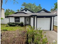 Charming single-story home with well-maintained lawn and attached one car garage at 8209 Volusia Pl, Tampa, FL 33637