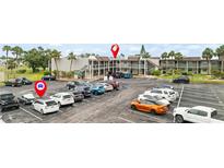 Well-maintained parking lot with ample spots available in front of the complex at 1028 Apollo Beach Blvd # 203, Apollo Beach, FL 33572