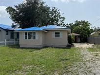 Modest single-story home featuring a covered roof, white shutters, and a quaint front yard at 3130 19Th N St, St Petersburg, FL 33713