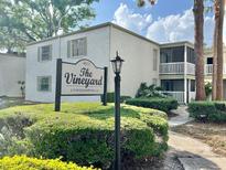 Charming condo complex with mature landscaping and private screened in patio at 4611 W North B St # 125, Tampa, FL 33609