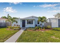 Charming single-story home with a well-manicured lawn and inviting walkway at 4755 21St N Ave, St Petersburg, FL 33713