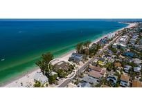 Beautiful aerial view of beachfront property on Anna Maria Island with turquoise waters and white sandy beaches at 8226 W Gulf Blvd # 2, Treasure Island, FL 33706
