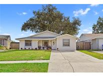 Charming single-story home with a well-maintained front yard and inviting curb appeal at 12529 Mondragon Dr, Tampa, FL 33625