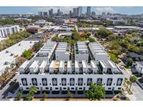 Modern townhomes boast rooftop patios with a stunning view of the Tampa skyline in a vibrant urban setting at 1330 W Gray St # 2, Tampa, FL 33606