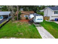 Charming single-Gathering home with a well-maintained lawn and private driveway at 1726 Massachusetts Ne Ave, St Petersburg, FL 33703