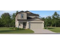 Charming two-story home featuring a two-car garage and landscaped front yard at 2251 Blue Grosbeak Pl, Wimauma, FL 33598