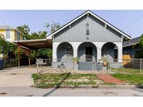 Charming bungalow-style home with a covered carport and front porch arches at 2825 N Taliaferro N Ave, Tampa, FL 33602