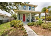 Charming two-story home with a cozy front porch and well-maintained landscaping at 4301 5Th N Ave, St Petersburg, FL 33713